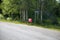 Three mail boxes at a bus stop in Finland