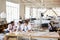 Three male architects in discussion in an open plan office