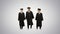 Three male students in graduation robes and mortar boards warming up while waiting on gradient background.