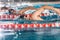 Three male swimmers doing free style in different swimming lanes