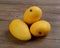 Three mango on wooden