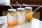 Three mason jars with fresh ice cold lemonade drink