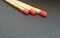 Three matchsticks over black background. Closeup of matchsticks.