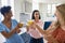 Three Mature Female Friends At Home Celebrating With Cocktails Together