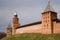 Three medieval defensive towers of the Kremlin of Veliky Novgorod, cloudy April day. Russia