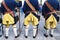Three men from behind in historical Swedish soldier uniforms of