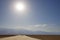 Three men silhouetted at Badwater Basin, Death Valley