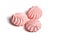 Three Meringue cookies. Pink Meringues kisses isolated on white background