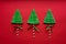 Three meringue trees in New Year`s style on a red background
