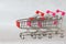 Three metal trolleys from the supermarket, assembled into one for compact storage. White background. Close-up