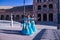 Three middle-aged Hispanic women, wearing turquoise costumes and rhinestones, to belly dance. Belly dance concept