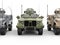 Three military all terrain vehicles - front view closeup shot