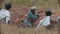 Three military men in trench are getting ready to shoot in their enemies