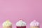 Three Mini Fancy cupcake on pink background