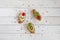 Three mini sandwiches on wooden background, flat lay