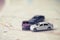 Three Miniature cars accident crash on road, insurance case and broken toys auto car on on Bangkok city map background. Vehicle