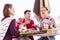 Three modern freelancers eating fruits outside