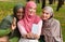 Three Modern Muslim Ladies Making Selfie On Phone Sitting Outdoors