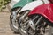 Three mopeds painted in colors of the Italian flag