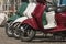 Three mopeds painted in colors of the Italian flag