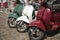 Three mopeds painted in colors of the Italian flag