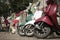 Three mopeds painted in colors of the Italian flag