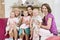 Three mothers in living room with babies