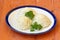 Three mounds of cooked rice with curly parsley