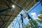 Three mounters holding solar panels on high metallic construction.