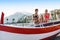 Three multiethnic girls posing in swimsuits on the italian coast