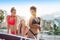 Three multiethnic girls posing in swimsuits on the italian coast