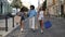 Three multiethnic girls walking with shopping bags