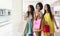 Three multiracial girls shopping together in mall