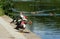 Three Muscovy Duck`s on edge of pond.