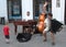 Three musicians playing in the street of Bratislava and small boy giving them money