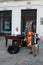 Three musicians playing together in the street of Bratislava and small boy giving them money