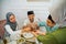three Muslim families take dates when breaking the fast