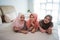 Three muslim woman lying and enjoy chatting on the bed