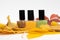 Three nail polish bottles with yellow autumn leafs. Green, brown, yellow nail varnish bottles