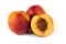 Three nectarine fruits with half cut one on white background