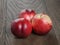 Three nectarines on old wood oak table