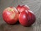 Three nectarines on old wood oak table