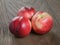 Three nectarines on old wood oak table