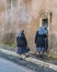 Three Nuns at Door of Building