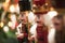 Three nutcracker christmas decoration figure on a bokeh background falling in line and warm holiday spirit..