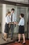 Three office workers at door of boardroom