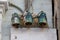 Three old-fashioned out-of-date ceramic insulators for a hand-made electric line mounted on an old damaged wall