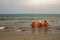 Three old ladies sea bathing in the Caribbean