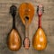 Three old mandolins on a background of rough burlap texture