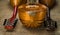 Three old mandolins rotated fingerboards to the camera on a background of rough burlap texture.